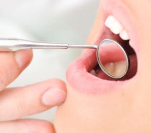 Teeth checkup at dentist's office. Image: Zurijeta/Shutterstock.com.