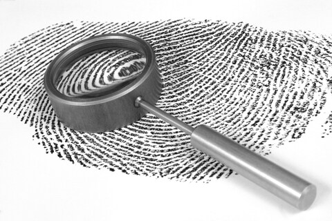 Fingerprint picture with magnifying glass - almost a biomarker...