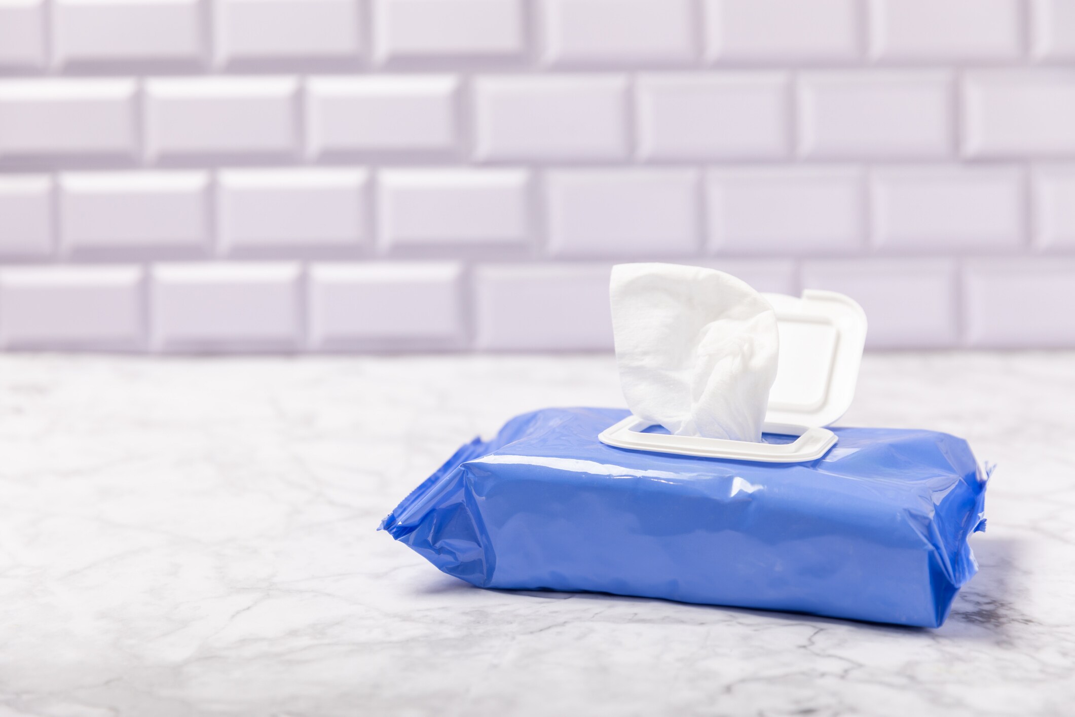 Packaging of wet wipes on background. An open pack of hand and body wipes. Mockup. A clean packet of wet wipes.