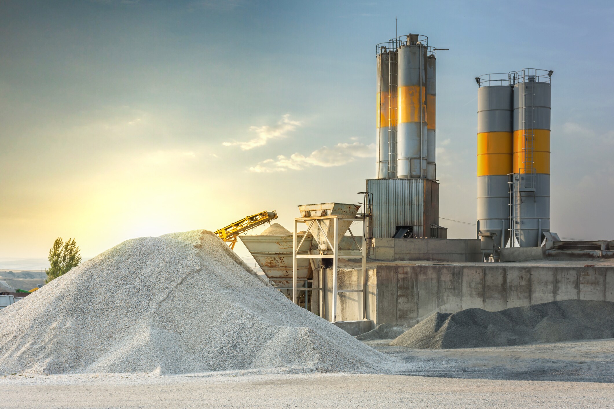 cement manufacturing plant with piles of sand