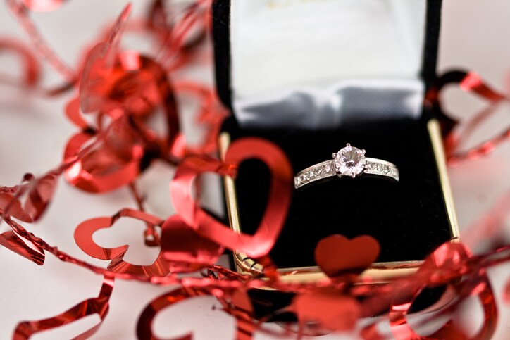 ring in box with Valentine heart decorations