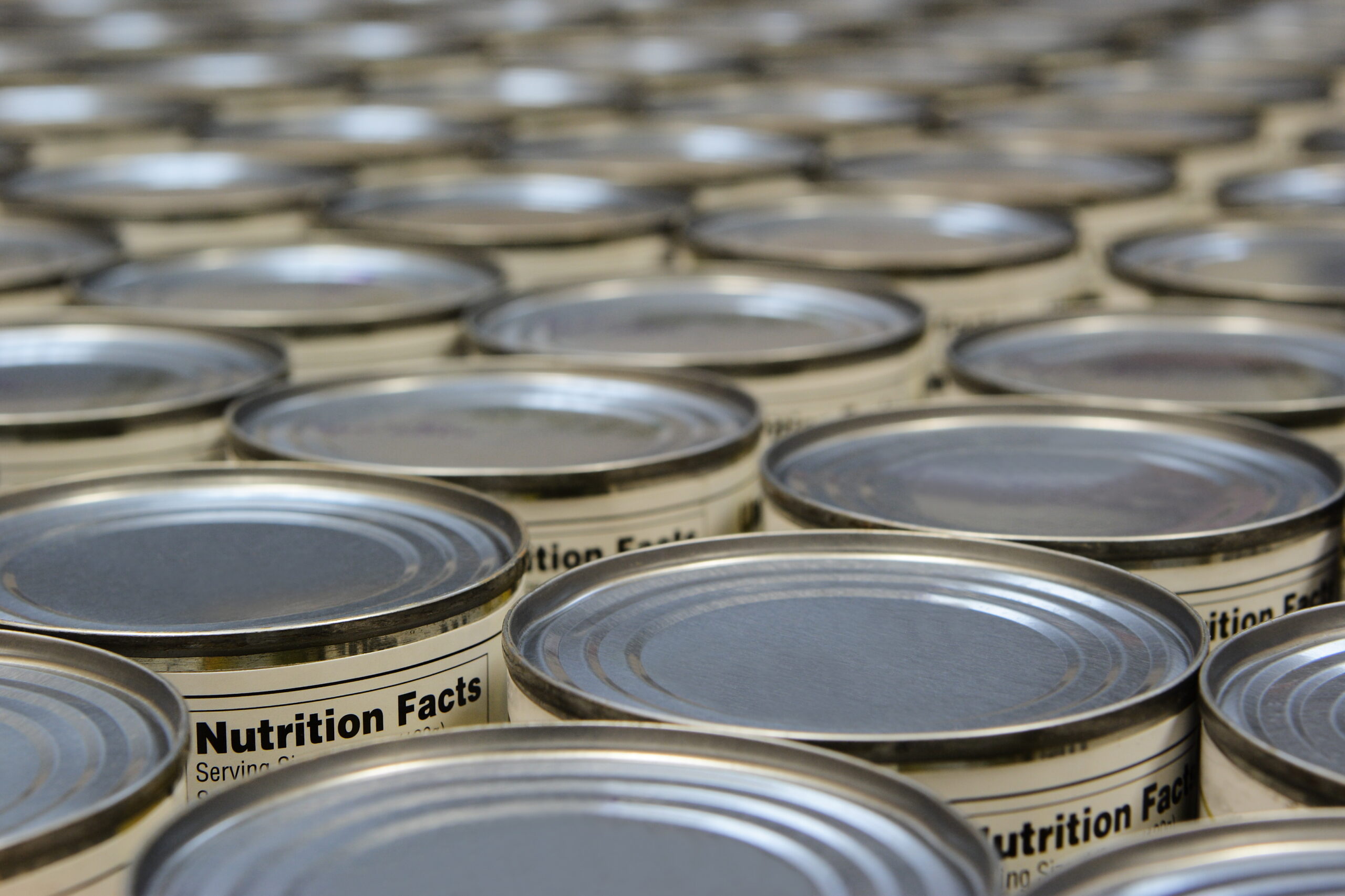 food cans showing nutrition facts labels.