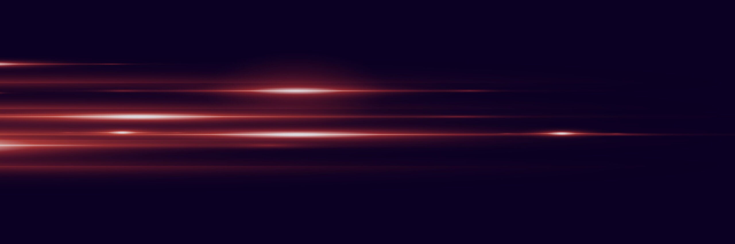 Abstract red light glare effect on a dark background.