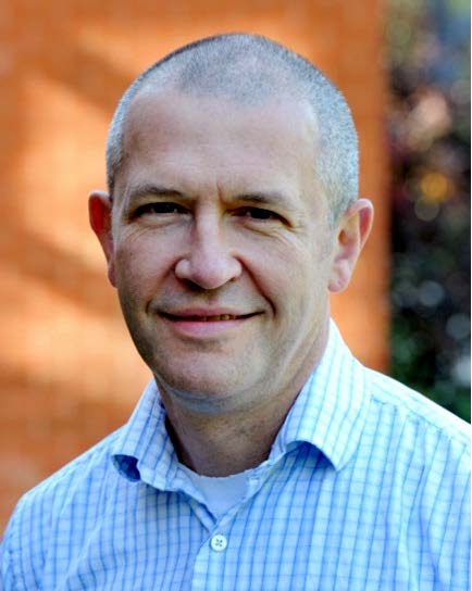 Professor Mark McCarthy looks at the camera