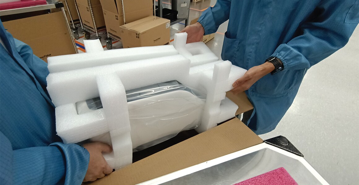Repair process of thermal cyclers A thermal cycler being unpackaged by two lab technicians to begin the repair process