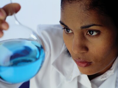 Liquids Chemist examining a flask of liquid
