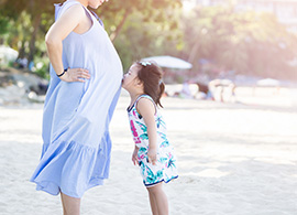 child kissing pregnant belly child kissing pregnant belly