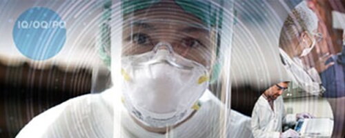 A group of researchers smile at the camera A group of researchers smile at the camera