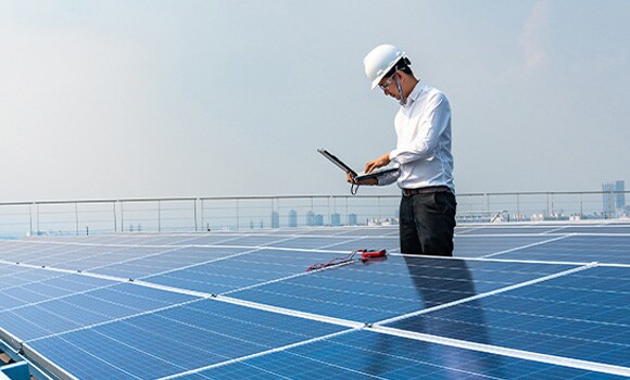 man evaluating solar panels man evaluating solar panels