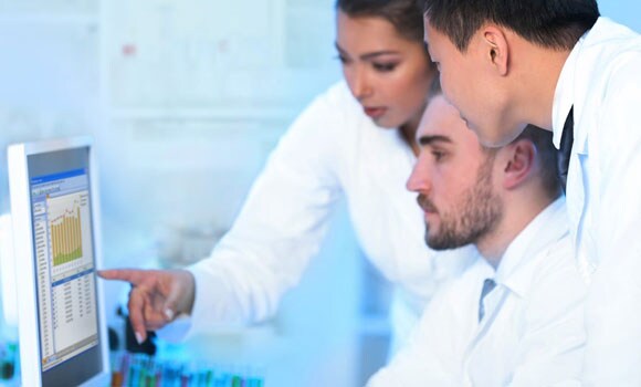 bioanalytical-featured Three scientists looking at Watson LIMS software