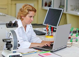 An academic researcher at a computer An academic researcher at a computer