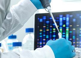 Gel Electrophoresis Applications: Preparative and Analytical Electrophoresis Scientist pipetting from a vial with a desktop in the background portraying DNA