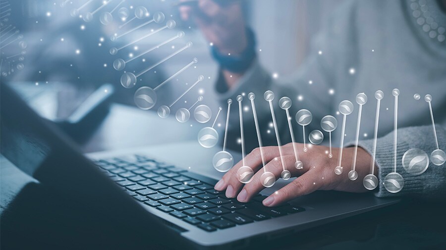Custom qPCR assays scientist working at a computer to create custom qPCR assays