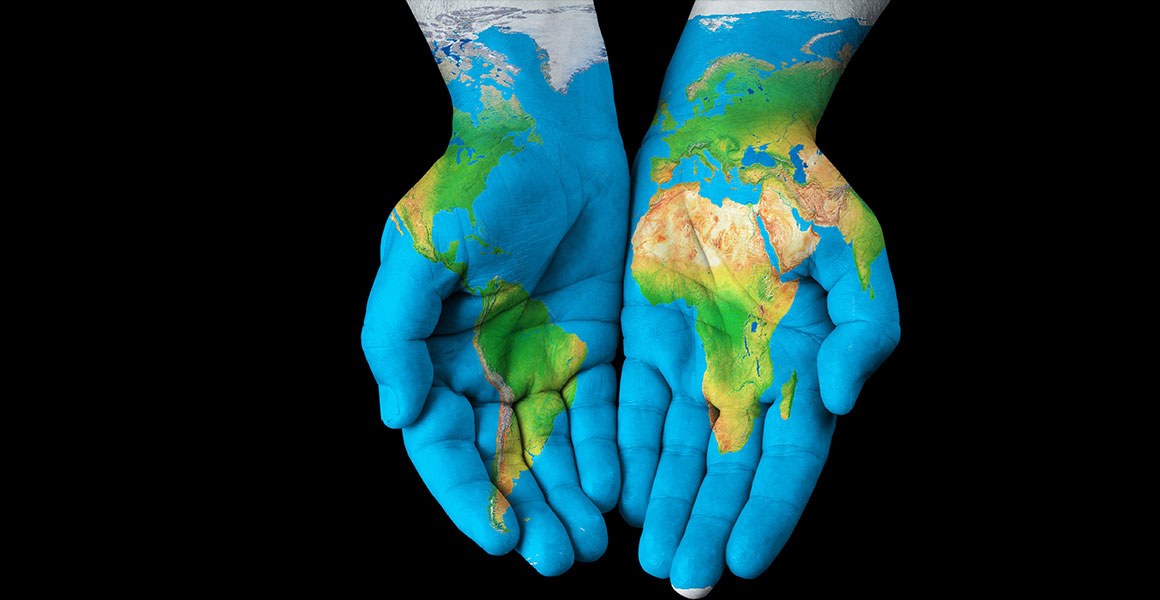 Hands painted with the global map Hands painted with the global map