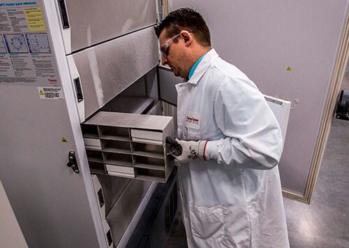 Gene therapy vials being pulled from freezer Gene therapy vials being pulled from -80C freezer in support of gene therapy commercialization