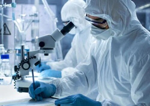 Scientist conducting documentation is support of gene therapy research Scientist conducting documentation is support of gene therapy research