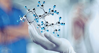 Article: Thermo Fisher Scientific Works to Combat Risking STI Epidemic with Better, Faster Testing Blurred background with gloved hand holding molecular model