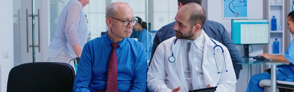 Doctor explaining treatment Doctor and senior patient at the hospital