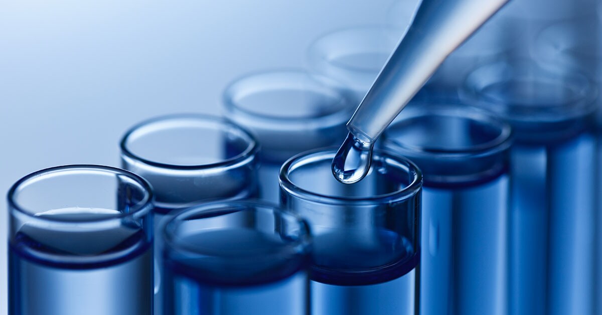 Pipetting wastewater samples in test tubes Pipetting wastewater samples in test tubes