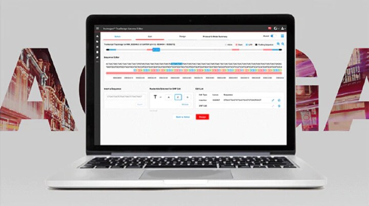 Invitrogen TrueDesign Genome Editor An open laptop, showcasing the online software tool, sits in the forefront with large DNA codons behind it.