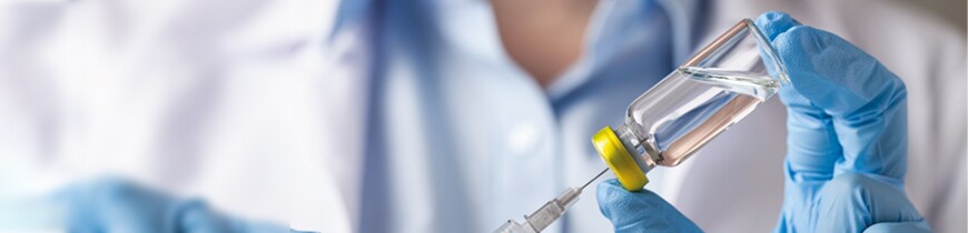 Advancements in Cell Biology Banner image depicting vaccine vial and syringe